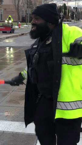 Police Officer Greets Cleveland Clinic Staff and Visitors With Dance Moves and High Fives