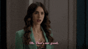 TV gif. Lily Collins as Emily in Emily in Paris furrows her brow in worry. Text, "Oh. That's not good."