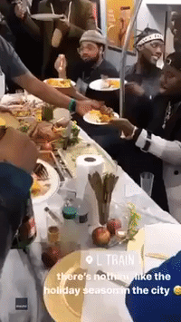 Passengers Celebrate Thanksgiving Early With Feast on the Subway