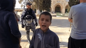 Child Leads Chants in Front of Al-Aqsa Mosque Amid Clashes Between Israeli Police and Palestinians