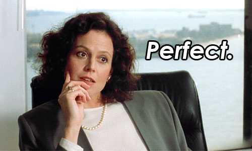 Movie gif. In a scene from Working Girl, Sigourney Weaver as Katharine Parker sits pensively in an office chair wearing a gray jacket and pearls. She reaches a decision, gesturing approvingly with her hand, and smiles as she speaks. Text, "Perfect."