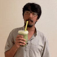 Drinking matcha boba milk tea