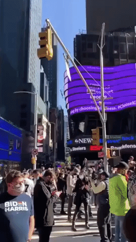 Revelers Gather in Times Square to Celebrate Biden's Projected Victory