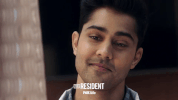 the resident smile GIF