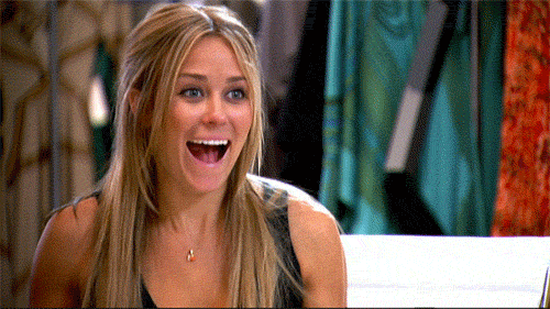 Reality TV gif. Lauren Conrad and Whitney Port on The Hills sit across from each other. They both scream and wave their hands around excitedly. 