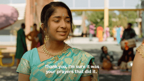 TV gif. Maitreyi Ramakrishnan as Devi in Never Have I Ever. She nods sarcastically while saying, "Thank you, I'm sure it was your prayers that did it."