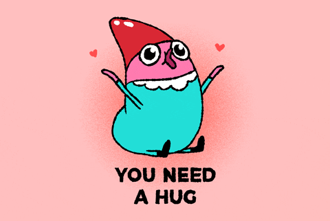 Cartoon gif. A cute character with a red hat holds its arms up. Text, “You need a hug.”