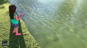 Father Teaches Daughter to Fish