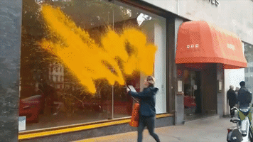 Just Stop Oil Protesters Spray Paint on Luxury Car Dealerships in London