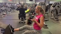 Woman Incorporates Wine Into Exercise Session