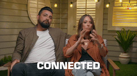 Gif of a woman interlocking her fingers with the caption "Connected"
