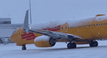 Airport Staff Deice Plane as Lake-Effect Snow Hits Rochester