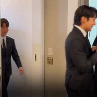 Jimin walks out of the press conference.