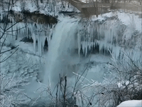Icicles Surround Minnesota Waterfall to Create Picturesque Winter Scene