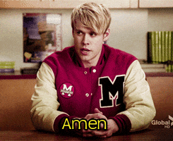 TV gif. Chord Overstreet as Sam Evans on Glee sits seriously and looks over at someone and spreads his mouth into a line after saying, “Amen.”