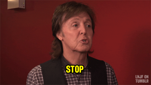 Tonight Show gif. Paul McCartney waves his pointer finger and says, “Stop.”