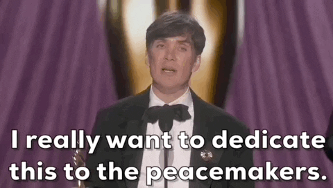 Oscars 2024 GIF. Cilllian Murphy wins Best Actor. He holds the trophy as he pumps out his arm and says, "I really want to dedicate this to the peacemakers."