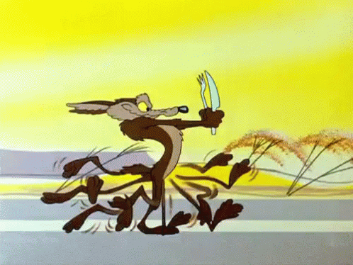 Cartoon gif. Wile E Coyote running hastily down a road, holding a knife and fork in his hands.