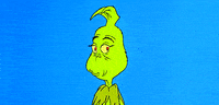 Movie gif. The Grinch from The Grinch Who Stole Christmas. He starts off looking cute and innocent, gazing softly at us, before morphing into his quintessential devious, conniving look.