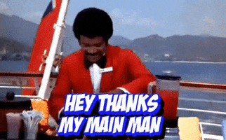 TV gif. Ted Lange as Isaac in The Love Boat. He gives us a cheesy smile and points at us with two finger guns and says, "Hey thanks, my main man. Stay cool!"
