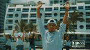 Lando Norris Beach GIF by Hilton Hotels