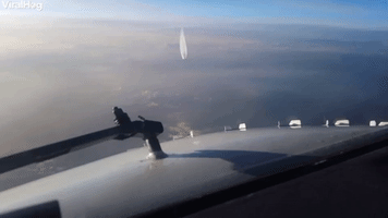 Oncoming Aircraft Passes Beneath Plane