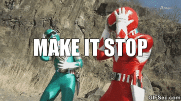 TV gif. Green Power Ranger and Red Power Ranger clutch their helmets in agony as if something is making their heads hurt. They move around uncomfortably. Text, “Make it stop.”