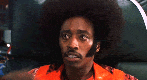 undercover brother hair flip GIF