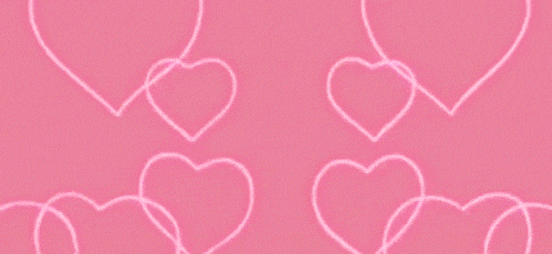 Video gif. Rays of bright neon pink hearts shoot out and into the center, forming a singular heart. 