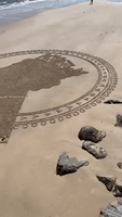 Queen Elizabeth II's Profile Etched Into Sand at Adelaide's Brighton Beach