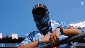 NYCFC fan showing off the badge 