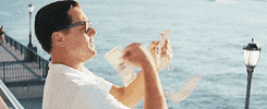 hustling wolf of wall street GIF