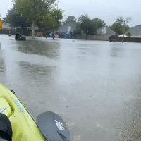 Woman Kayaks Through Floodwaters on the Gulf Coast of Texas