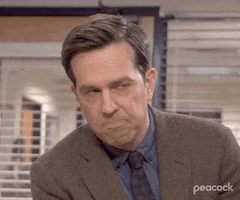 The Office gif. Ed Helms as Andy Bernard shakes his head while frowning, as if to say, "nah."