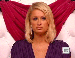 Celebrity gif. Paris Hilton looks pouty as she shakes her head weakly.