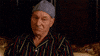 TV gif. Patrick Stewart as Walter Blunt in Blunt Talk. He sits in a luxurious bed with a crochet beanie on and raises a glass at us proudly to cheers.