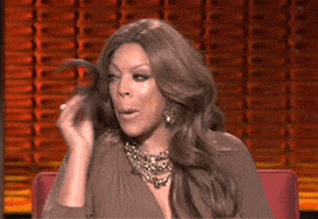 Reality TV gif. Wendy Williams on the Wendy Williams Show. She uses a lock of hair to comedically dab at her face, wiping tears away.