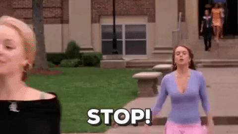 Movie gif. Lindsay Lohan as Cady Heron in Mean girls runs after Rachel McAdams as Regina George with her arms out and yells, “Stop!”