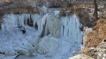 Minnehaha Falls Remain Frozen as Fresh Snow Falls in Minneapolis