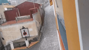 Floodwater Rushes Down Street in Alicante as Heavy Rain Hits Eastern Spain