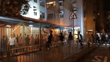 Officers Confront Protesters Near Hong Kong Police Station