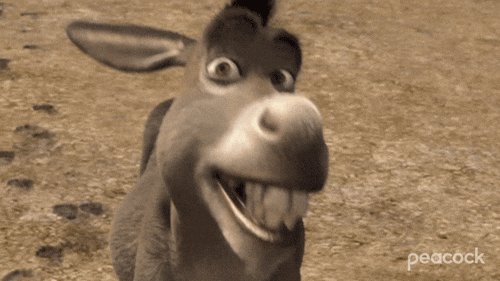 Movie gif. Donkey from Shrek looks at us smiling and blinking innocently.