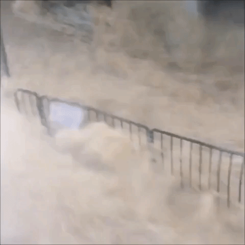 Monsoon Turns Hong Kong Streets Into a Raging River