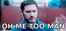 Video gif. A man holds up one hand while the text below him reads“Oh me too man.”