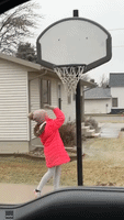 'Ow!' Little Girl Swings at Frozen Basketball Net as Icy Conditions Hit Eastern North Dakota