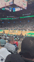  Fan Courtside at Celtics Game Distracts Spectator