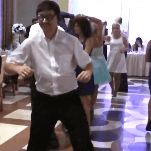 Video gif. A man at a wedding does a dorky dance on the dance floor.