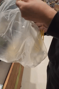 Frugal Supermarket Shopper Peels Banana