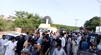 Crowds Surround Vehicles Leaving Imran Khan's Residence After Terrorism Charges Filed Against Former Prime Minister