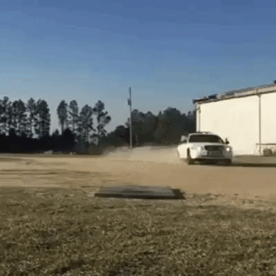 cop rolling out of car GIF